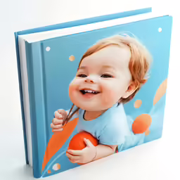 a little baby that is holding a book