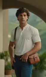 a man wearing a white polo shirt is carrying a bag