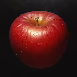 an apple with some water drops on it