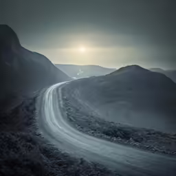a very big beautiful road by some mountains