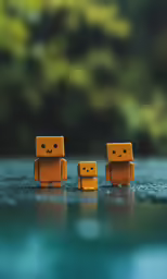 two little yellow robots are standing next to each other
