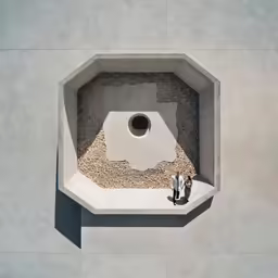 two people in front of a concrete wall and hole