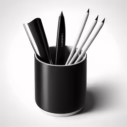 several pens in a cup with their tops turned upside down