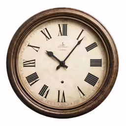 an antique clock hanging from a wall