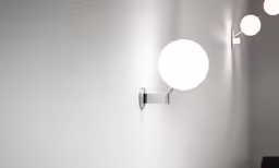 several light bulbs are shining on the wall