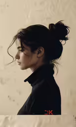 an image of a woman with dark hair in ponytails