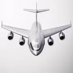 an airplane is flying through the air on a gray day