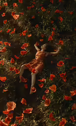 there is a woman laying down in the field