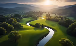 an aerial view of a river running through a valley with mountains in the background
