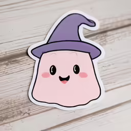 a sticker with a happy little pink and purple hat
