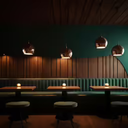 the inside of a restaurant with some tables and seating