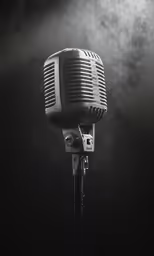 a vintage microphone stands up on a stand
