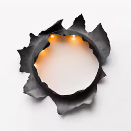 a light is lit inside of a metal decoration