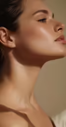 close up of female in profile wearing a necklace