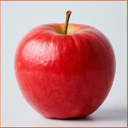 an apple sitting upright against a white background