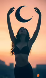 woman with belly up in front of a crescent moon at sunset