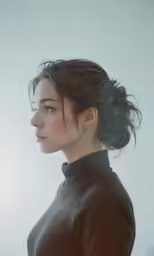 a woman with her hair up in a high ponytail