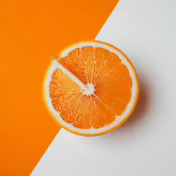 an orange slice that is cut in half