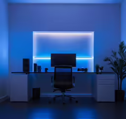 a black chair in the middle of a dark office