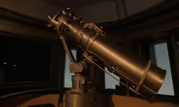 a large telescope sitting in front of a window