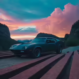 a car parked on a hill overlooking a mountain at sunset