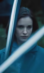 the young girl is looking out of the window
