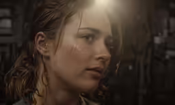 a close up of a person in a room with a light on