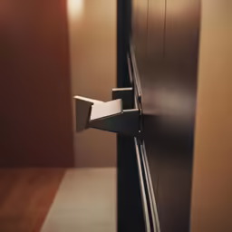 a close up of an office door handle on a wall