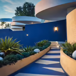 a couple of planters are on the edge of a walkway