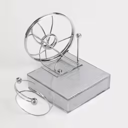 a kitchen gadget and saucer set in a plastic container