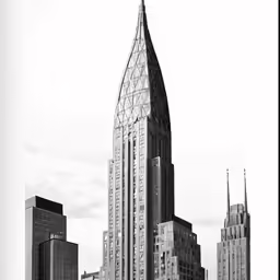 a very tall building sitting in the middle of a large city