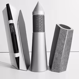 three electronic devices on white table top with one being a microphone