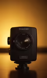 camera with flash attached to its housing on the surface