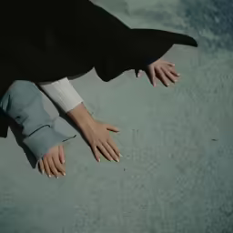 the woman is wearing white and black heels