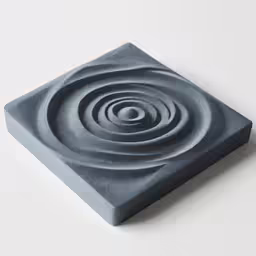 a square ceramic object with wavy shapes