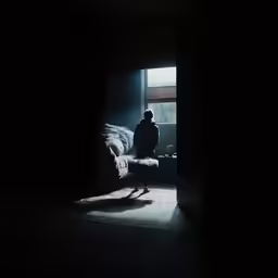 a person is standing at the door way