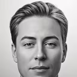 a man with blonde hair posing for a picture