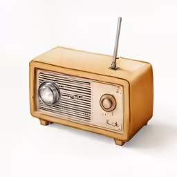 an old radio is on a white surface