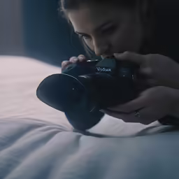 a woman taking a photo with her camera