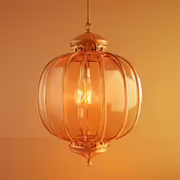 an ornate lantern light fixture against a plain backdrop