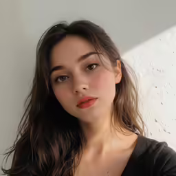 a beautiful young woman in a black top