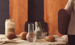 a table with some bread and wine glasses