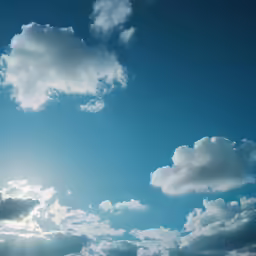 the sky is full of clouds with a jet in the middle