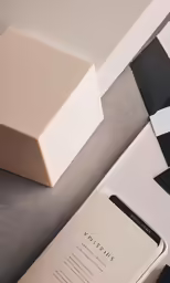 a block of paper that is sitting next to some papers