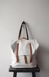 the back of an unisex handmade white backpack