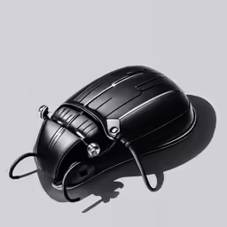 a black computer mouse with its key on the back of it