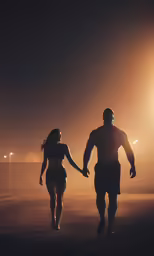 a man and woman are walking at night