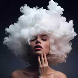 a white woman with a big hair covering her face
