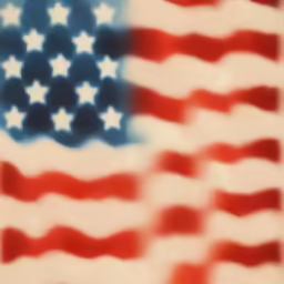 a small red white and blue american flag is on a sheet