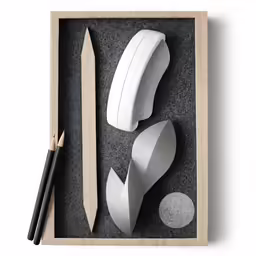 various objects in a box with black and white shapes